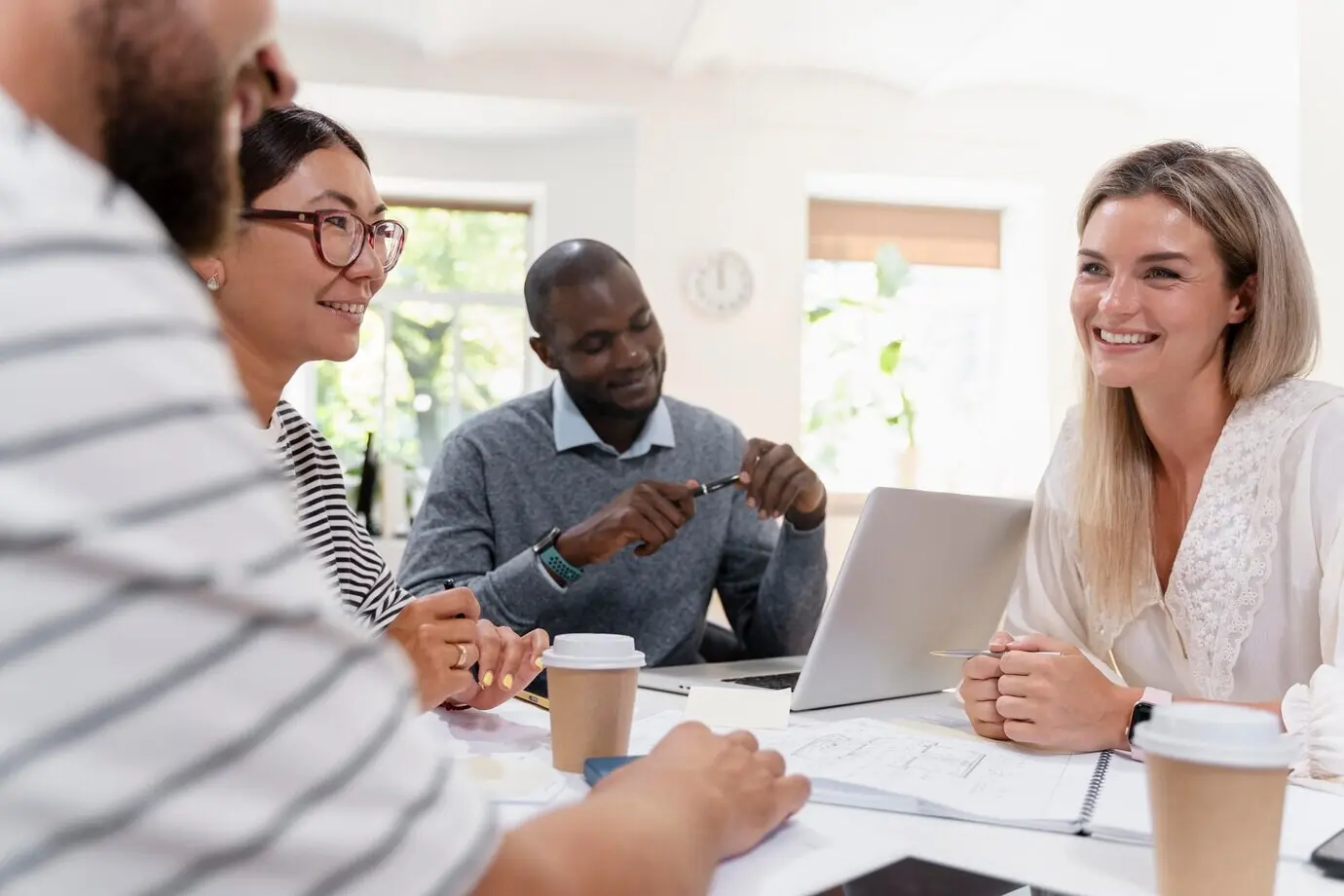 Close-up of young colleagues during a meeting